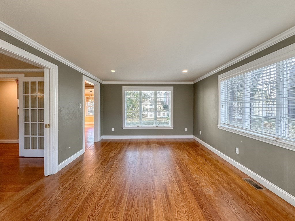 29 Douglas Road Needham, MA 02492 - Photo 10 of 42 a view of an empty room with wooden floor and a window
