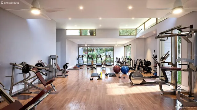 a living room with lots of furniture and a wooden floor