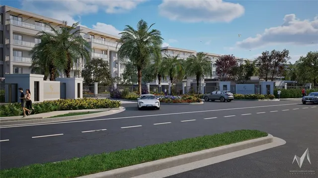 a city street lined with buildings and trees