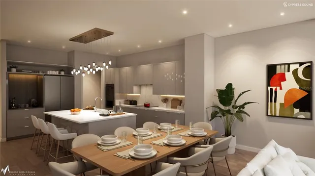 a dining room with furniture and a chandelier