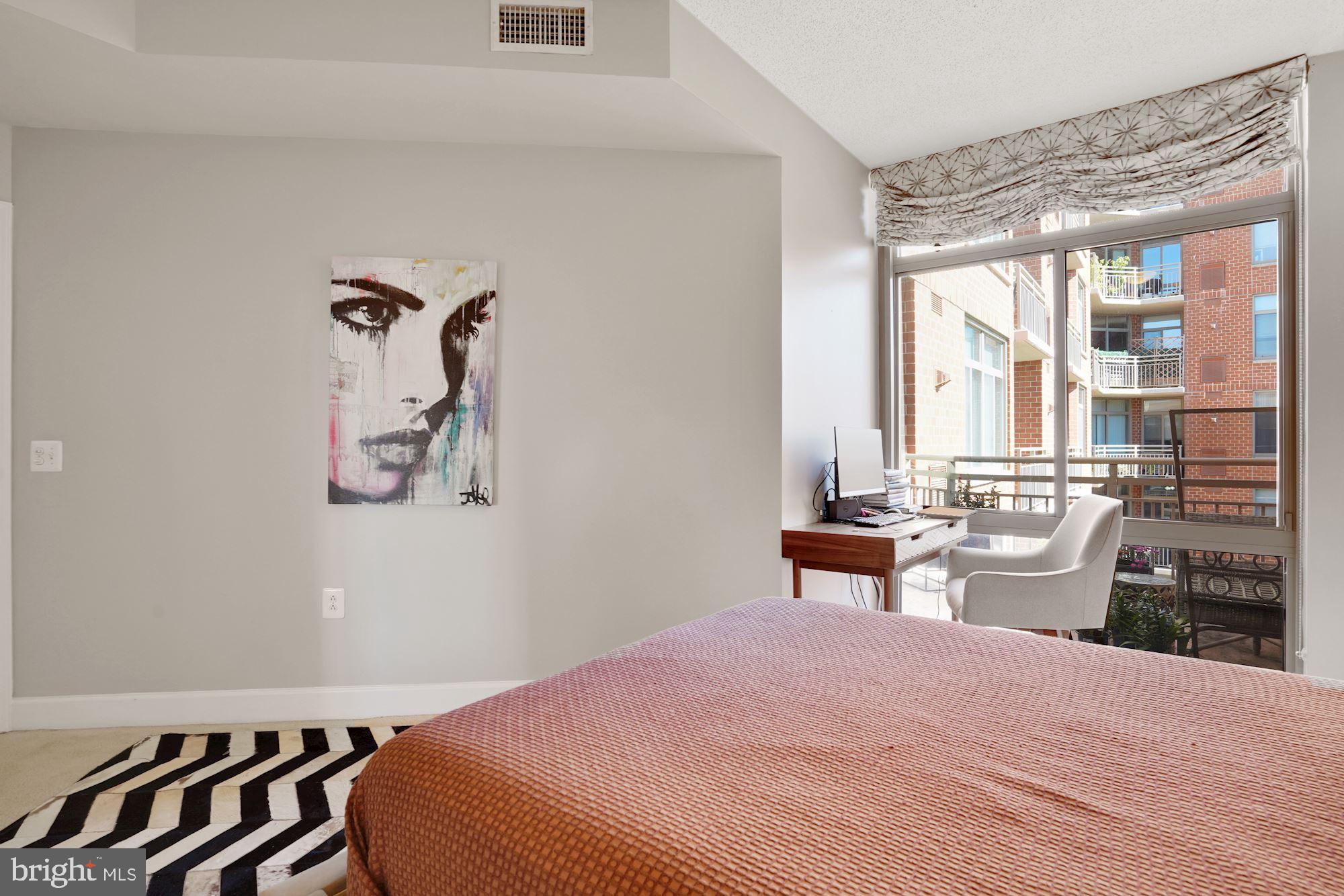 3600 South Glebe Road, Unit 632W Arlington, VA 22202 - Photo 20 of 41 a bedroom with a bed and wooden floor