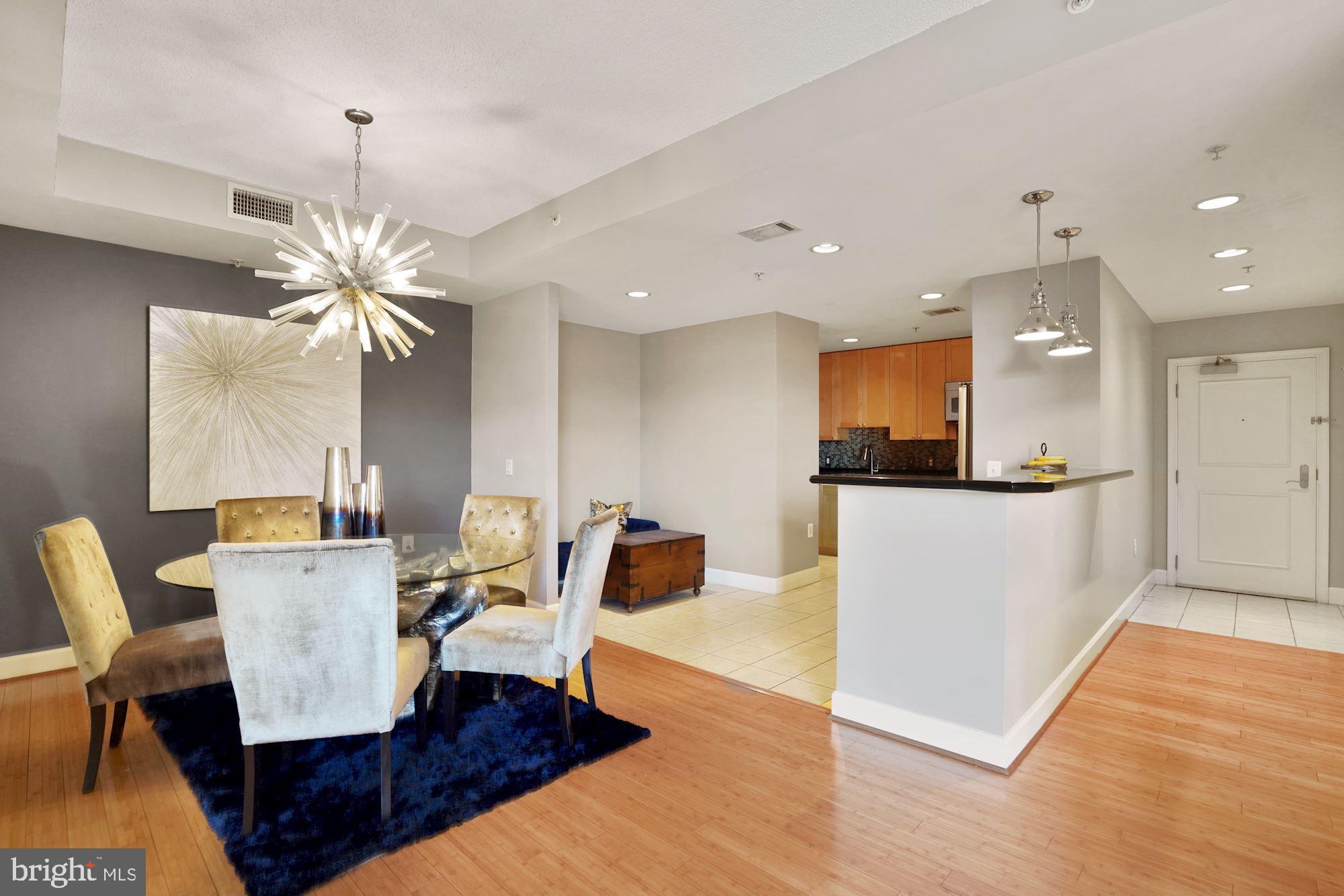 3600 South Glebe Road, Unit 632W Arlington, VA 22202 - Photo 3 of 41 a living room with furniture and a chandelier
