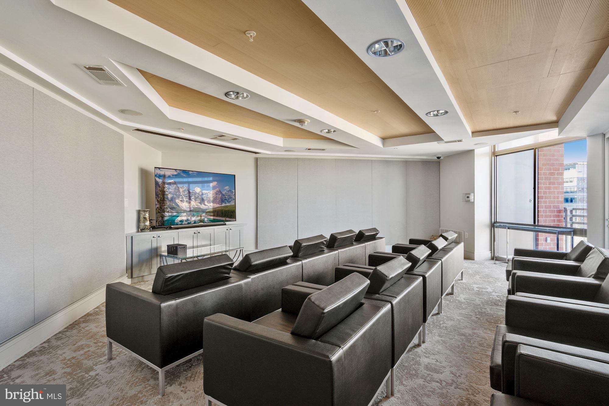 3600 South Glebe Road, Unit 632W Arlington, VA 22202 - Photo 33 of 41 a media room with lots of chairs and a projector screen