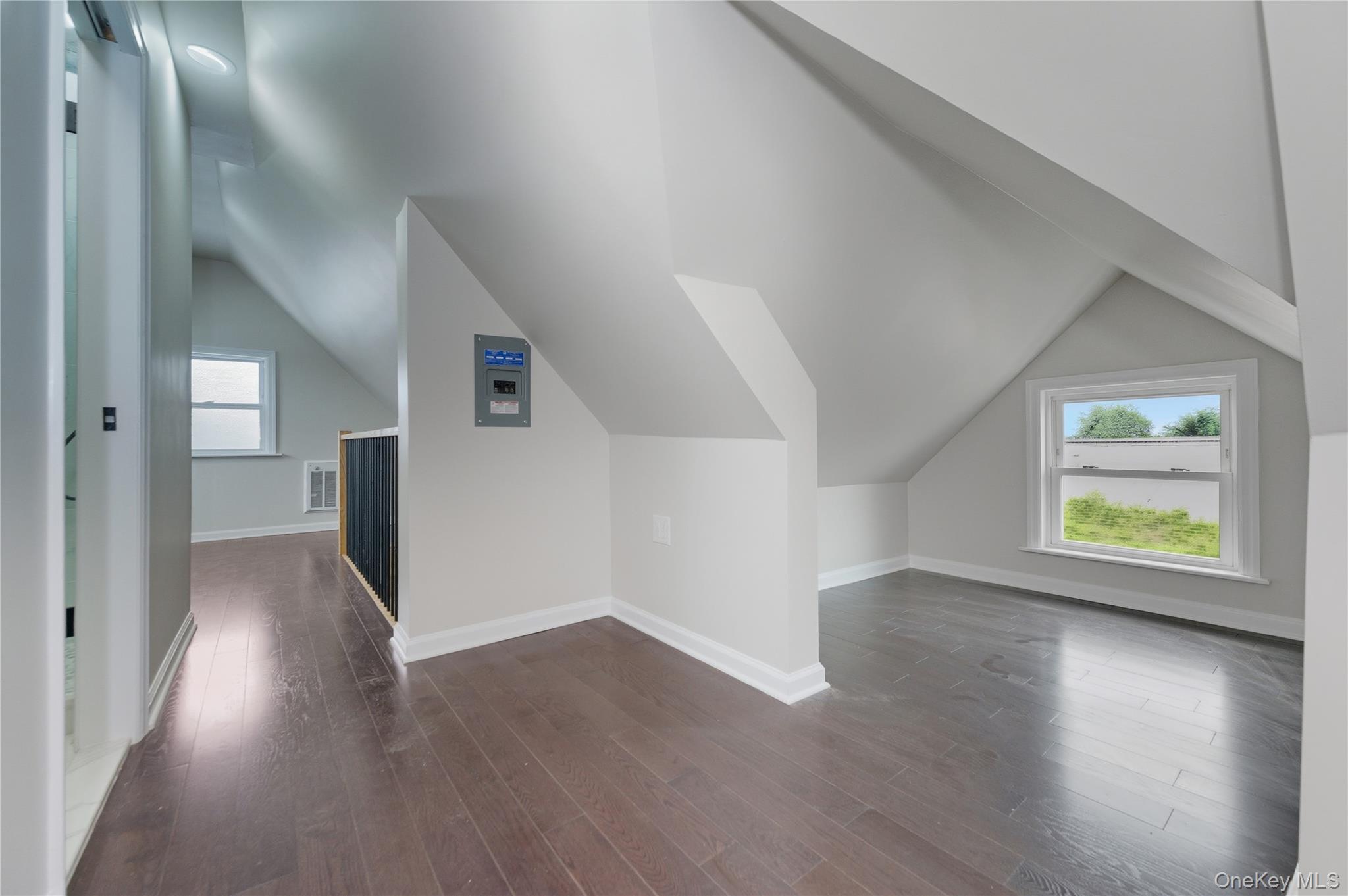 120 Maple Avenue, Unit 2 Cedarhurst, NY 11516 - Photo 11 of 17 an empty room with wooden floor and window