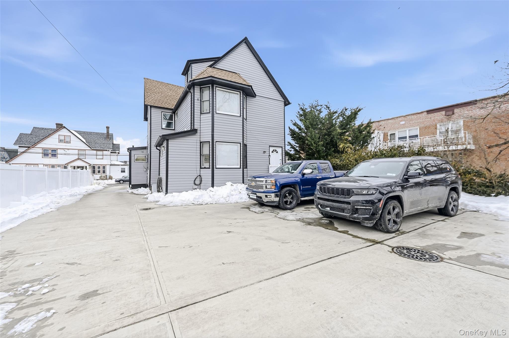 120 Maple Avenue, Unit 2 Cedarhurst, NY 11516 - Photo 17 of 17 a view of a house with a patio
