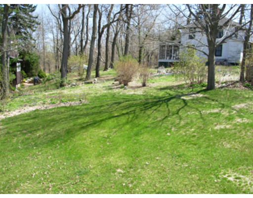 15 Johns Road Marblehead, MA 01945 - Photo 3 of 6 a backyard of apartments with large trees