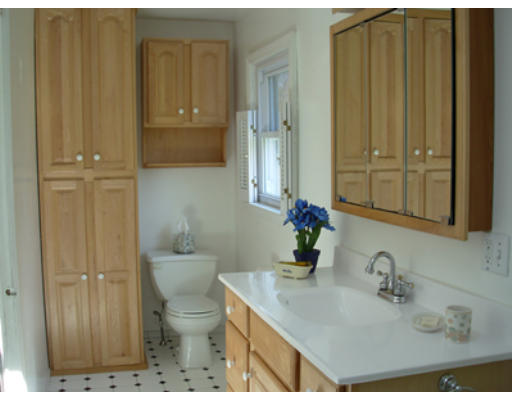 15 Johns Road Marblehead, MA 01945 - Photo 5 of 6 a bathroom with a granite countertop sink and a toilet