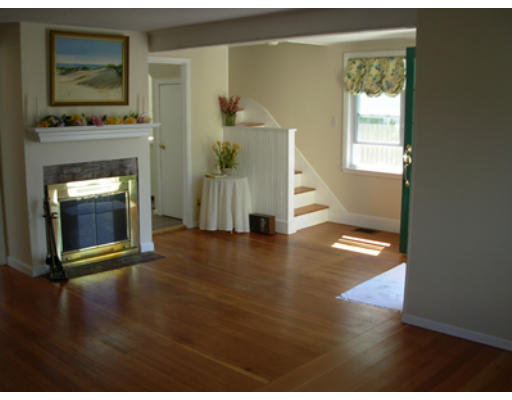15 Johns Road Marblehead, MA 01945 - Photo 6 of 6 a view of a livingroom with wooden floor and a fireplace