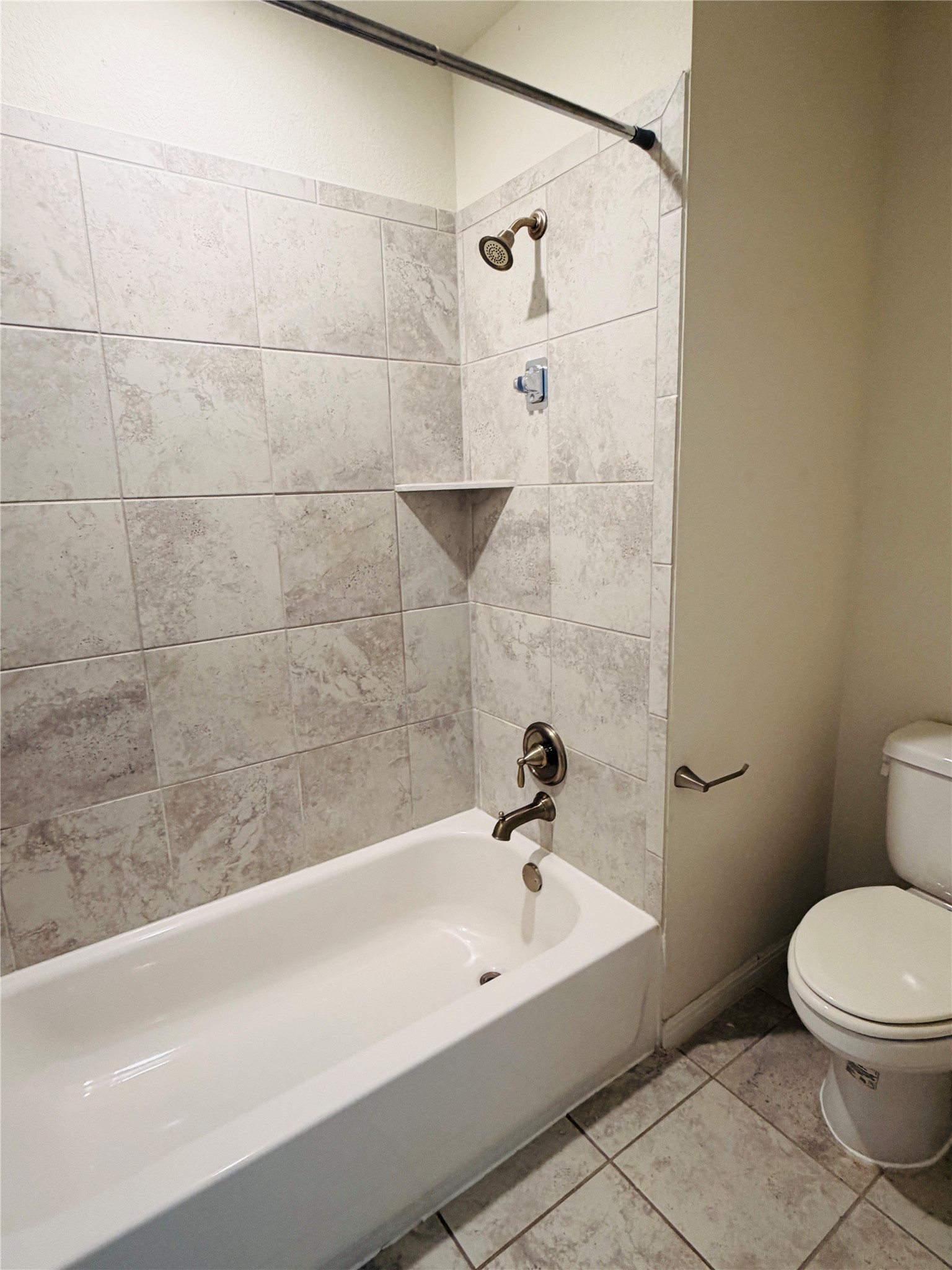 2013 Hat Bender Loop Round Rock, TX 78664 - Photo 10 of 16 Bathroom with bathing tub / shower combination and light tile patterned floors