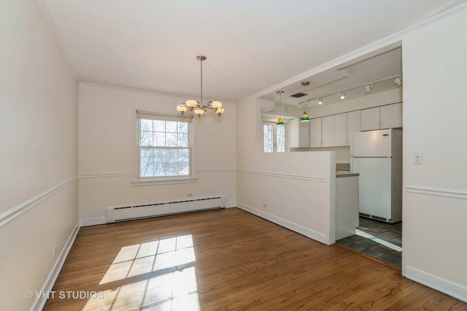 334 Ridge Avenue, Unit 3 Evanston, IL 60202 - Photo 4 of 12 a view of empty room with wooden floor and fan