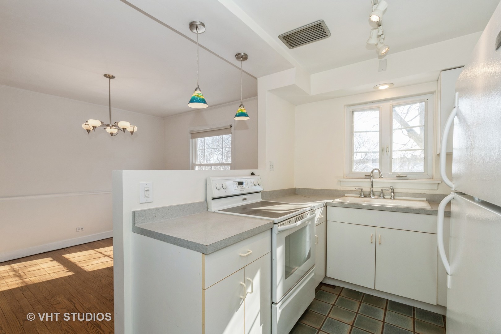 334 Ridge Avenue, Unit 3 Evanston, IL 60202 - Photo 5 of 12 a view of a sink a refrigerator and window