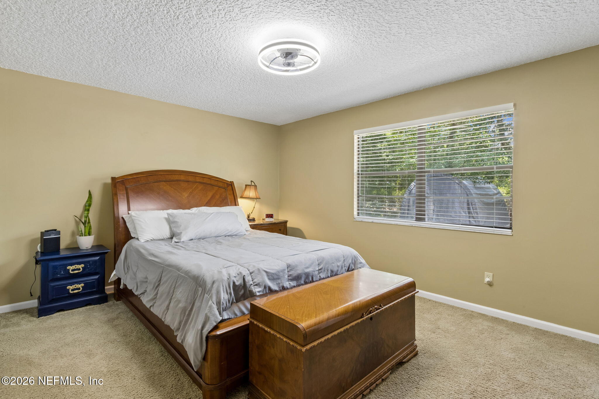 3194 Creighton Landing Road Fleming Island, FL 32003 - Photo 19 of 31 a bedroom with a bed and a window