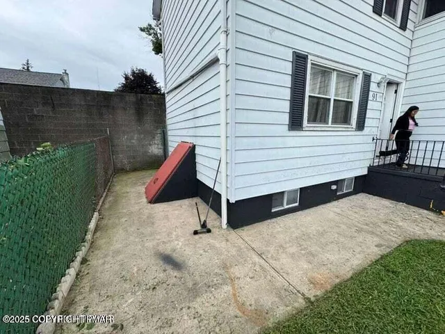 a view of backyard with a chair