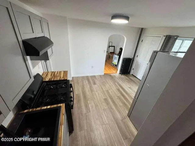 a bedroom with a bed and a tv