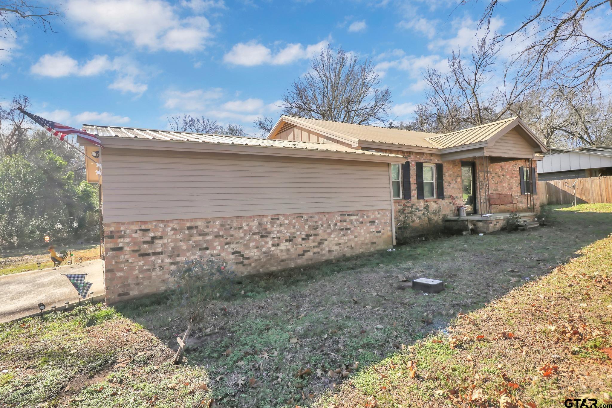 554 East San Antonio Street Alto, TX 75925 - Photo 27 of 28 a view of a house with a yard