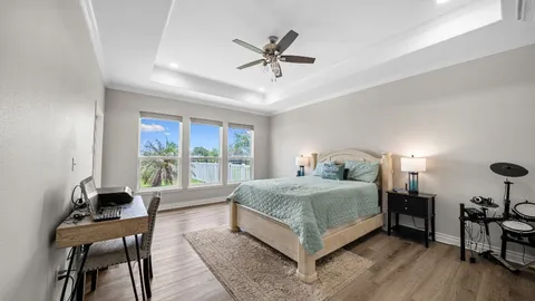a bedroom with a bed and a table