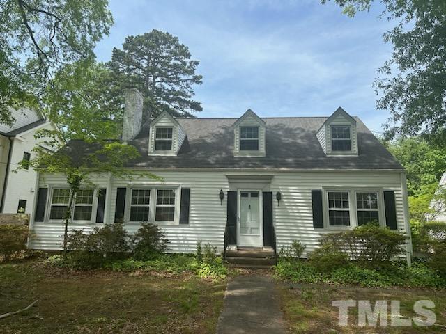 1309 Canterbury Road Raleigh, NC 27607 - Photo 1 of 32 front view of a house with a yard