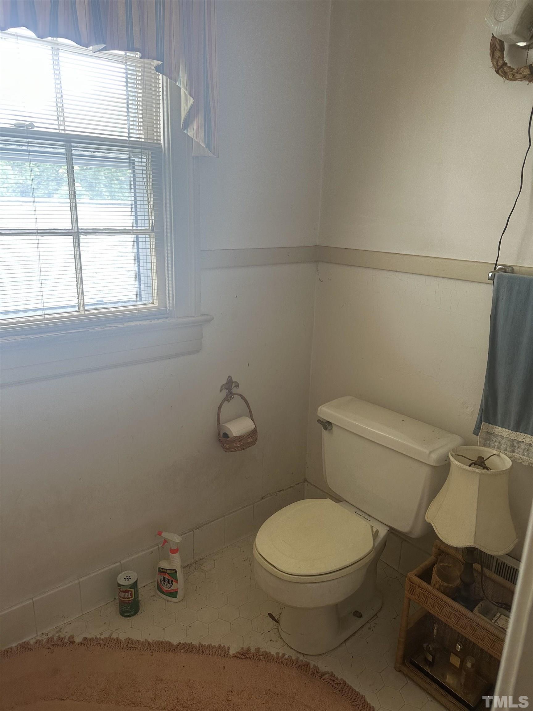 1309 Canterbury Road Raleigh, NC 27607 - Photo 24 of 32 a white toilet sitting next to a window