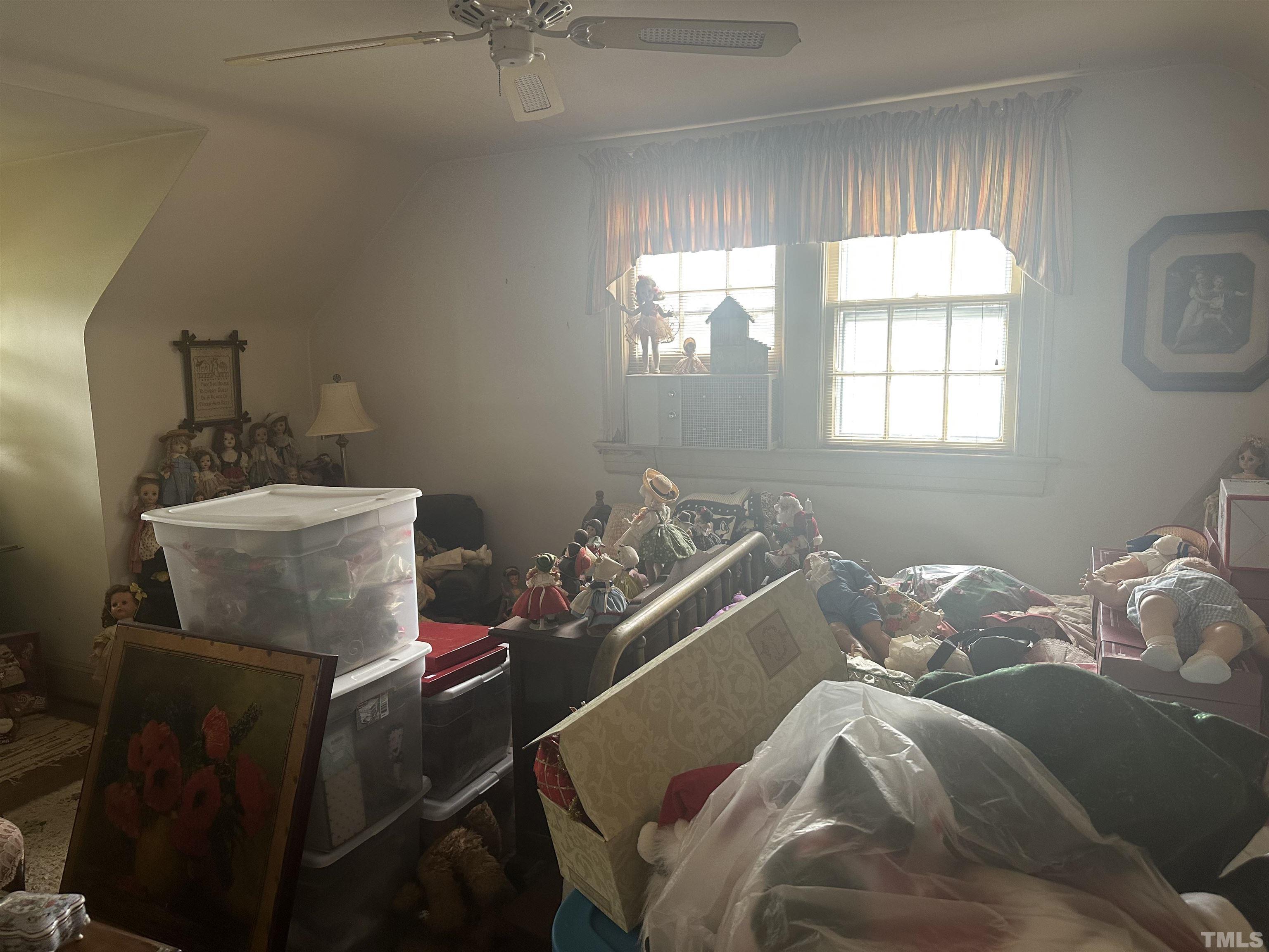 1309 Canterbury Road Raleigh, NC 27607 - Photo 26 of 32 a bed sitting in a bedroom next to a window