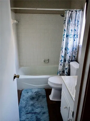 a view of balcony with wooden floor