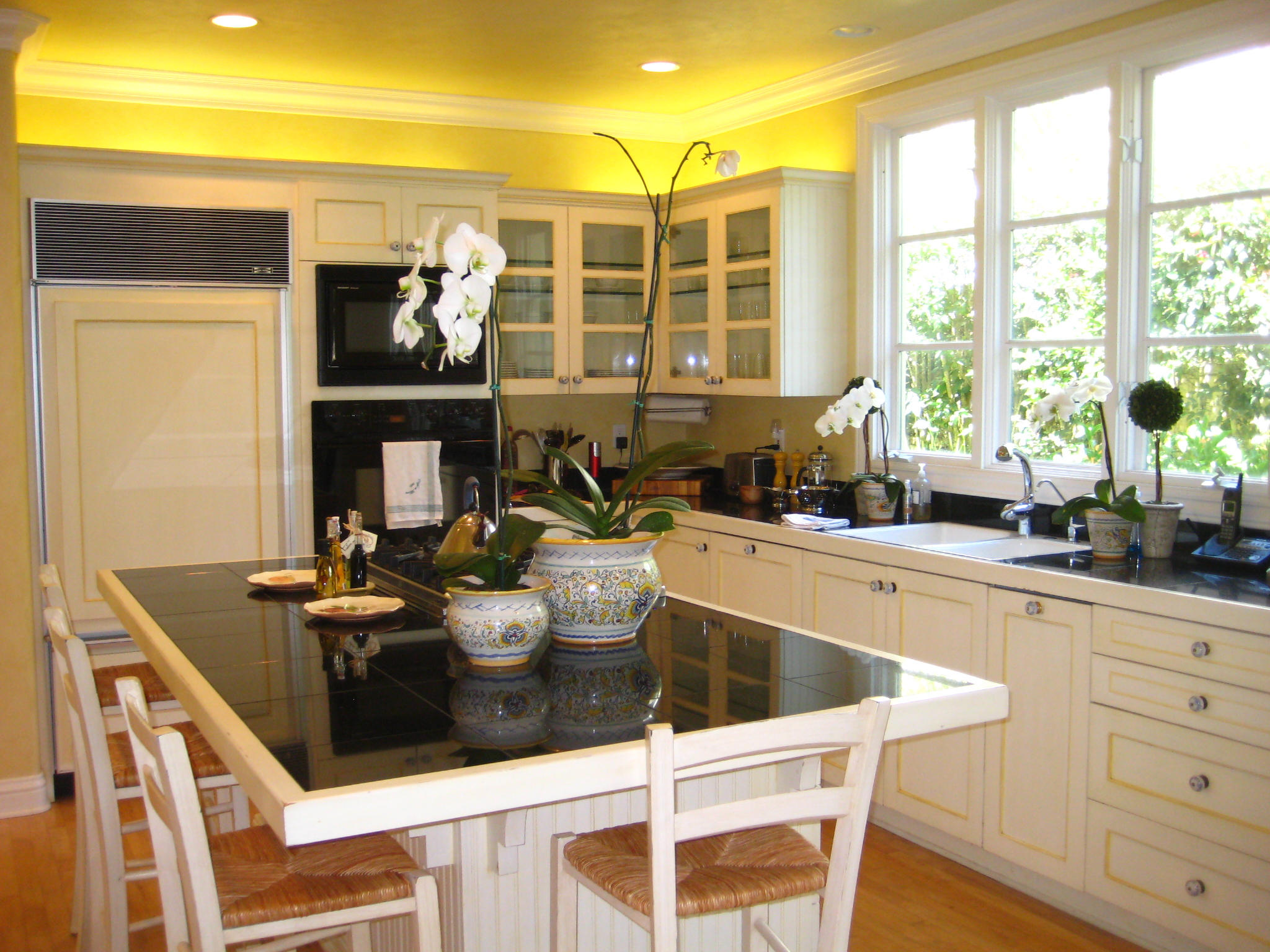 76 Depot Road Santa Barbara, CA 93108 - Photo 3 of 12 a kitchen with a table chairs and chandelier
