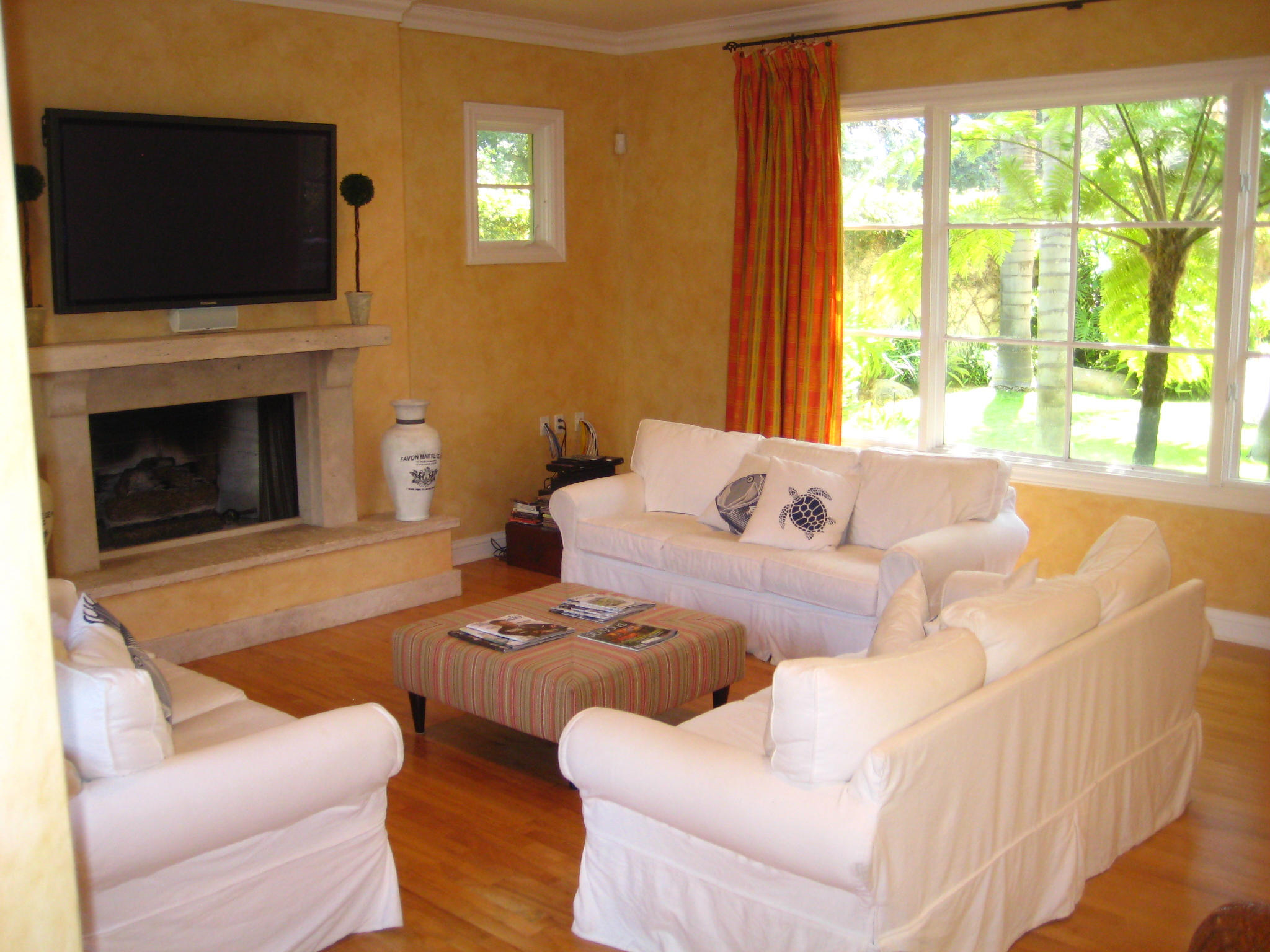 76 Depot Road Santa Barbara, CA 93108 - Photo 5 of 12 a living room with furniture a flat screen tv and a fireplace