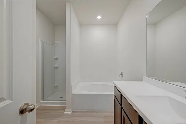 a white bath tub sitting next to a white toilet
