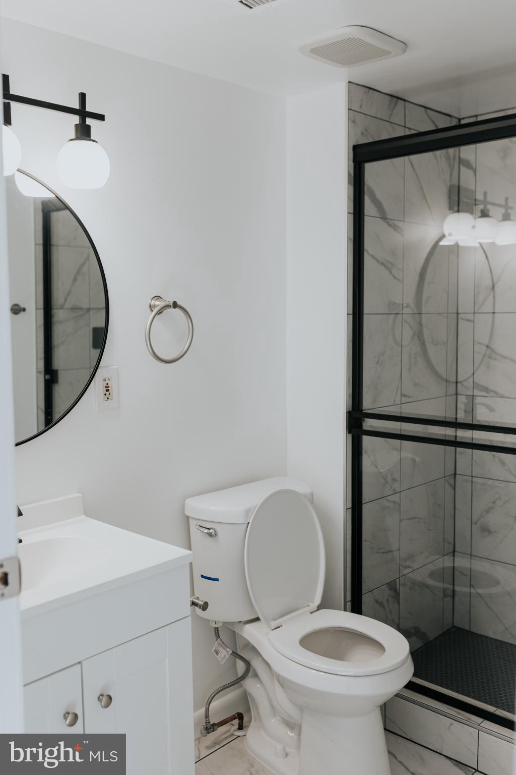 2511 Madison Avenue, Unit 3 Baltimore, MD 21217 - Photo 8 of 12 a bathroom with a toilet and a sink