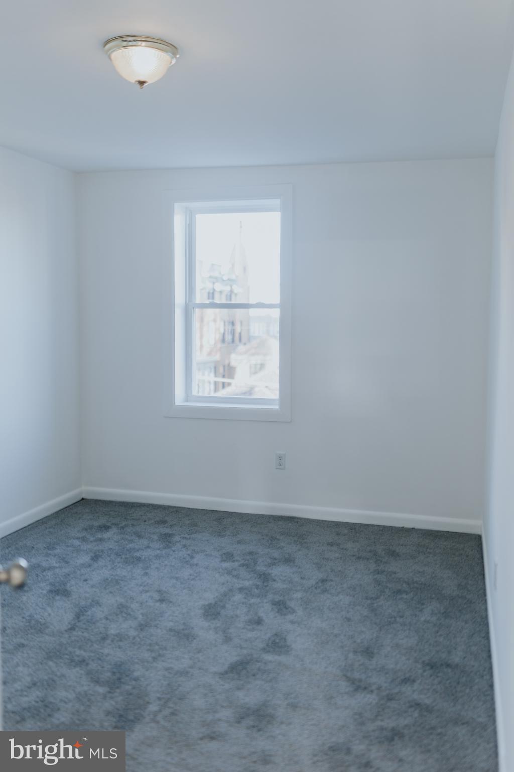 2511 Madison Avenue, Unit 3 Baltimore, MD 21217 - Photo 10 of 12 an empty room with a window