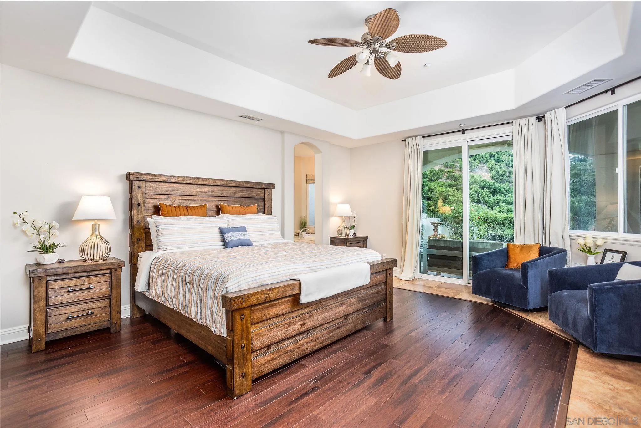 4003 Millagra Drive Fallbrook, CA 92028 - Photo 17 of 46 a bedroom with a bed and wooden floor