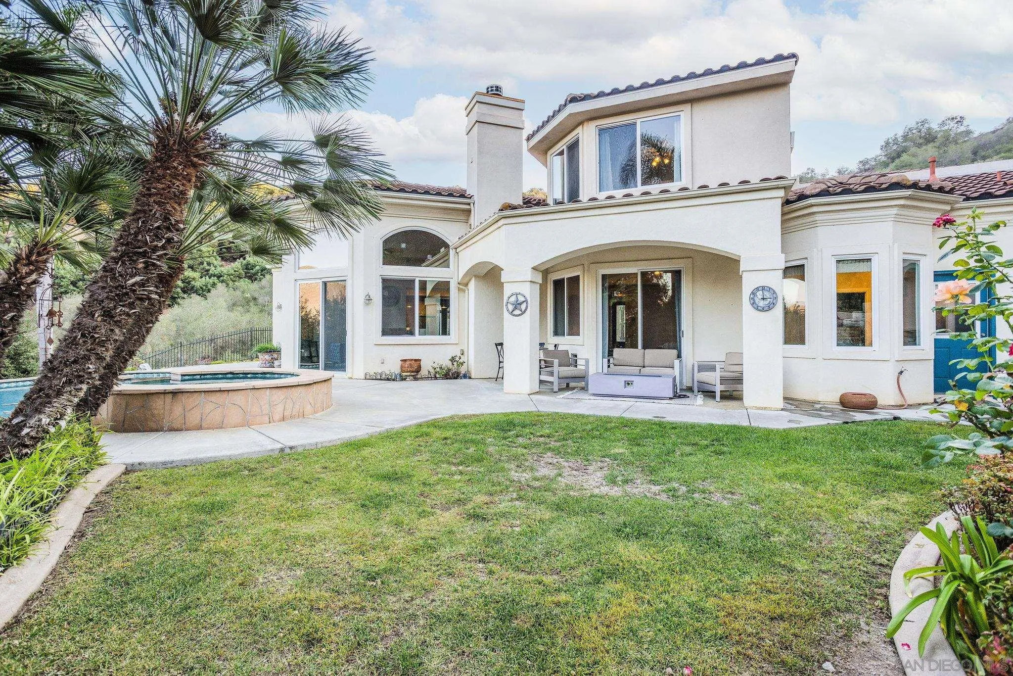 4003 Millagra Drive Fallbrook, CA 92028 - Photo 23 of 46 a front view of a house with swimming pool