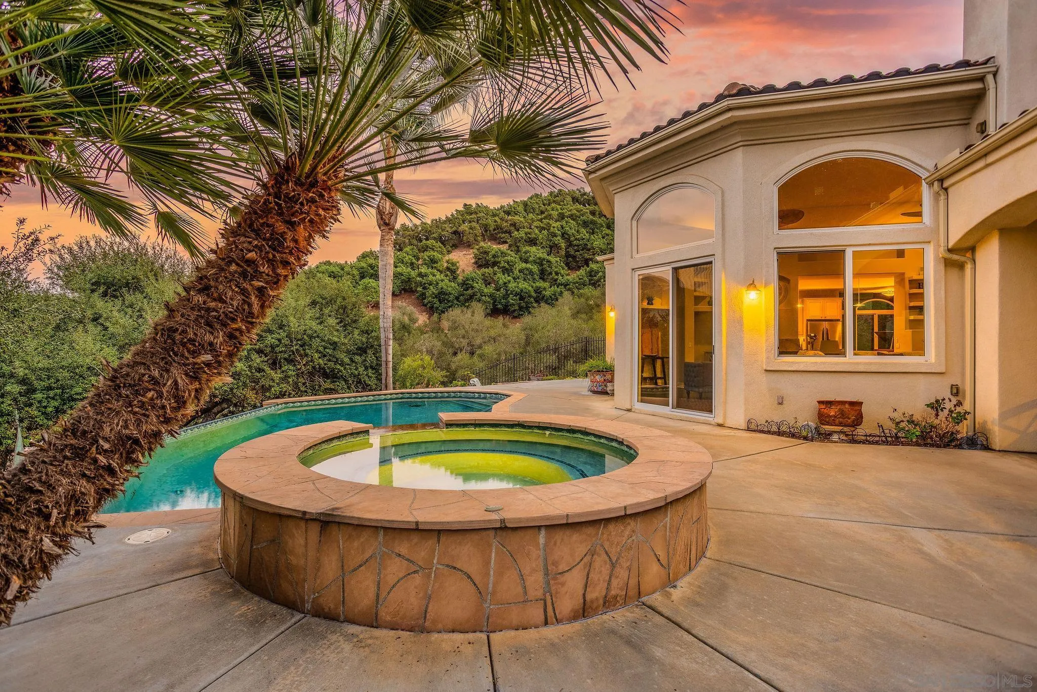 4003 Millagra Drive Fallbrook, CA 92028 - Photo 26 of 46 a view of a house with a swimming pool and porch