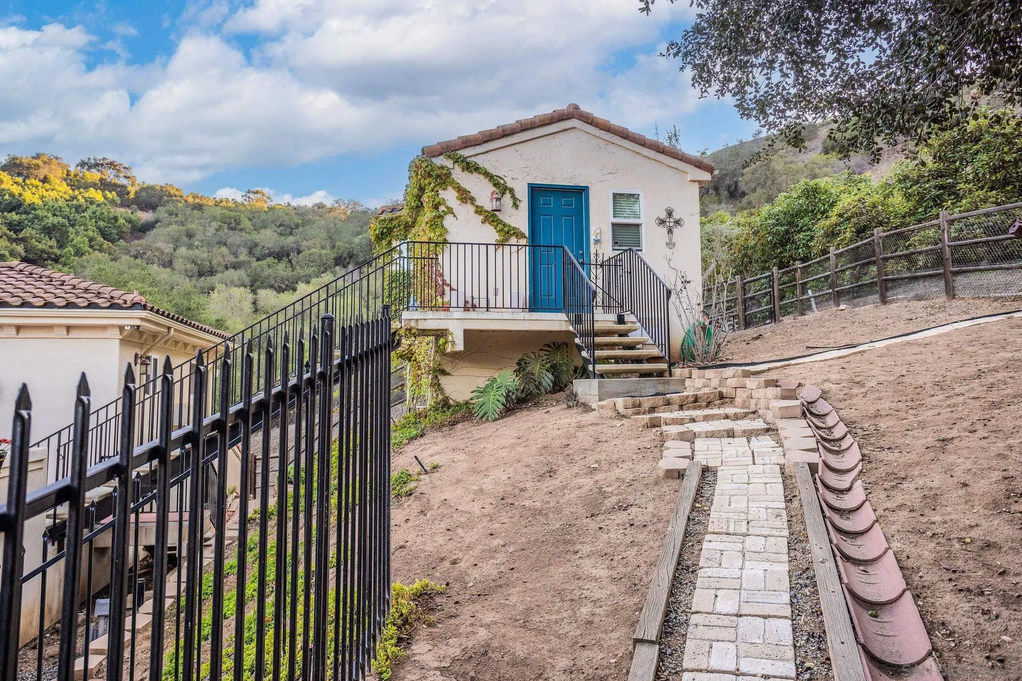 4003 Millagra Drive Fallbrook, CA 92028 - Photo 29 of 46 a front view of a house with a yard