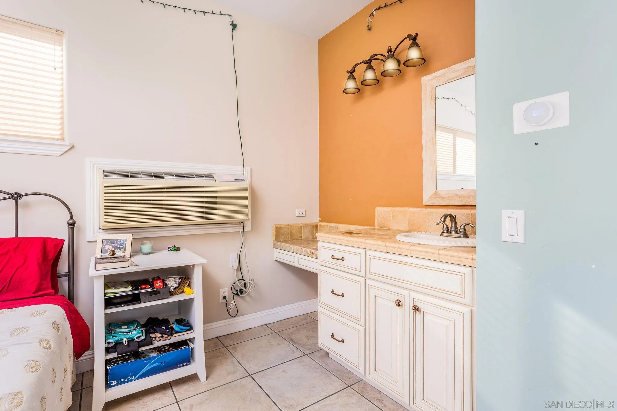 4003 Millagra Drive Fallbrook, CA 92028 - Photo 39 of 46 a bathroom with a sink vanity and a mirror