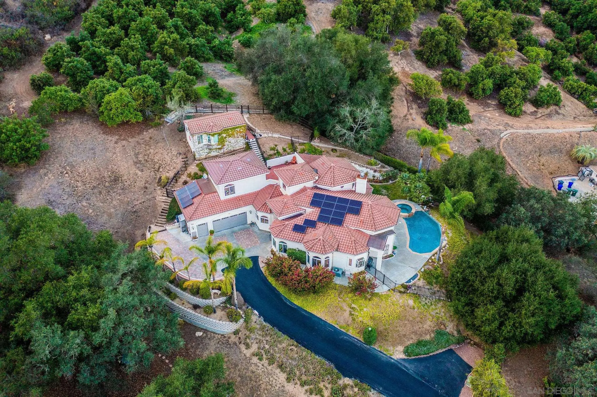 4003 Millagra Drive Fallbrook, CA 92028 - Photo 42 of 46 an aerial view of a house with a garden and swimming pool