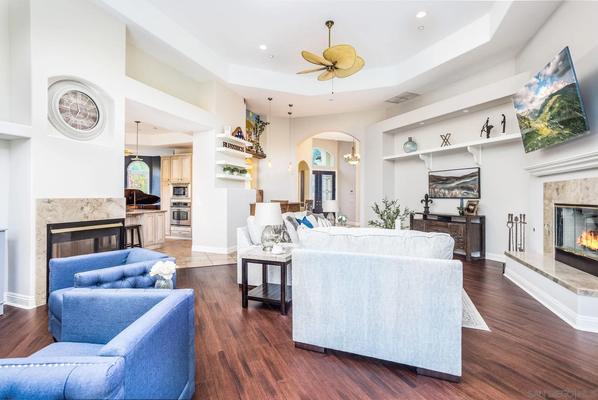 4003 Millagra Drive Fallbrook, CA 92028 - Photo 5 of 46 a living room with furniture a fireplace and a flat screen tv