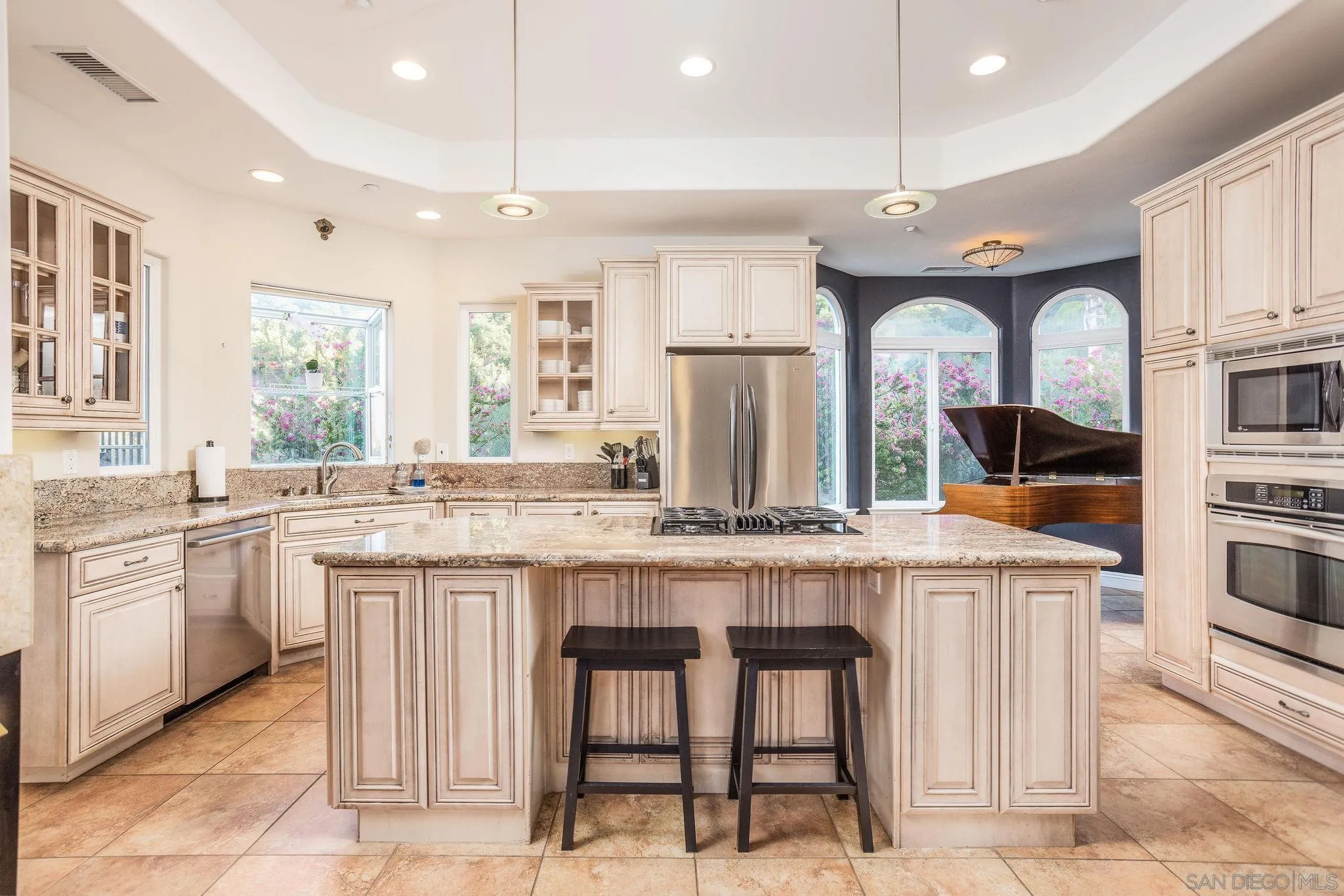 4003 Millagra Drive Fallbrook, CA 92028 - Photo 8 of 46 a kitchen with stainless steel appliances granite countertop a stove a sink and a refrigerator