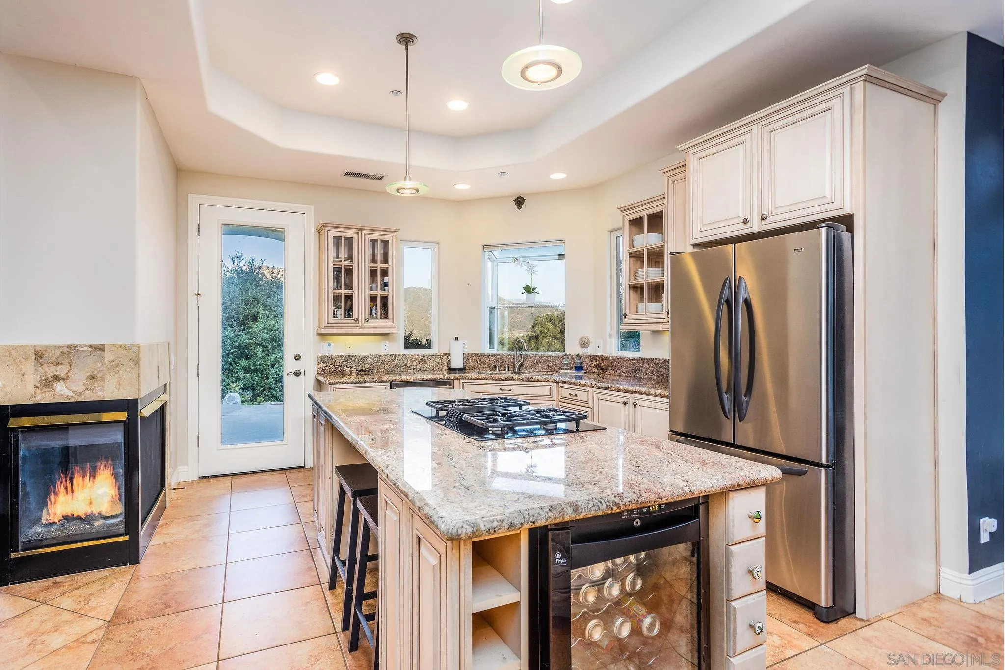 4003 Millagra Drive Fallbrook, CA 92028 - Photo 9 of 46 a kitchen with stainless steel appliances granite countertop a kitchen island a stove a refrigerator a oven and a refrigerator