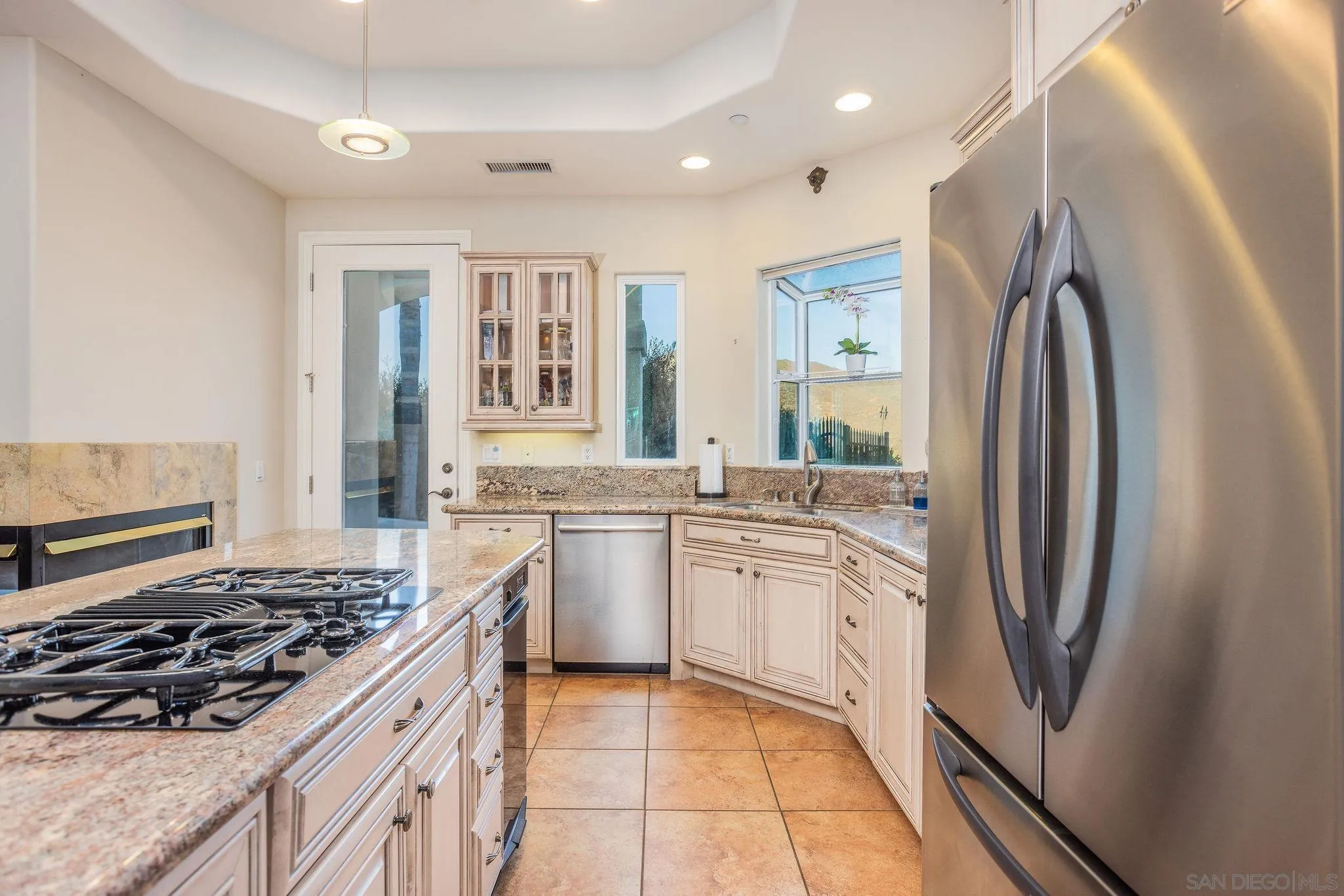 4003 Millagra Drive Fallbrook, CA 92028 - Photo 10 of 46 a kitchen with stainless steel appliances granite countertop a stove a sink and a refrigerator