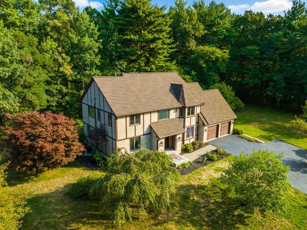 2 Braeburn Road Chelmsford, MA 01824 - Photo 5 of 7 an aerial view of a house with a yard table and chairs