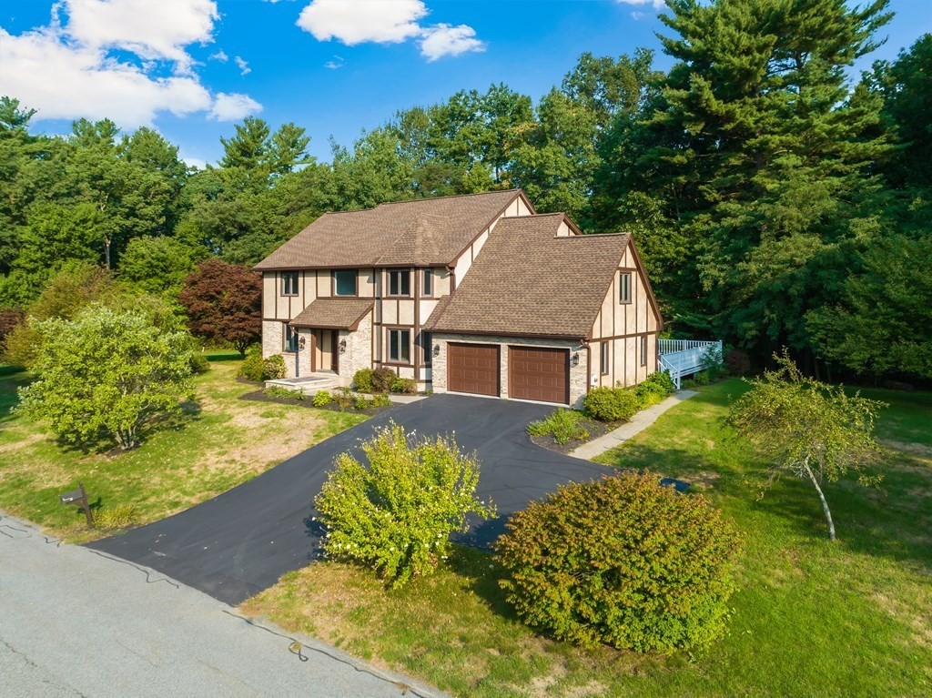 2 Braeburn Road Chelmsford, MA 01824 - Photo 6 of 7 a view of a house with a yard