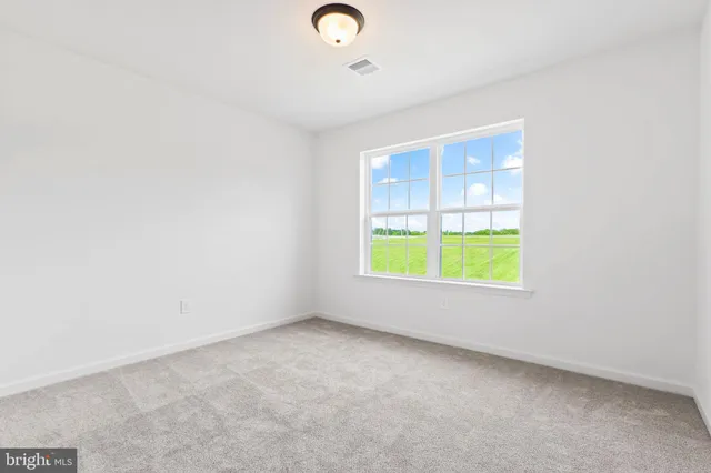 a view of a hallway with a white walls