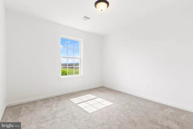 a view of a wooden deck with a yard