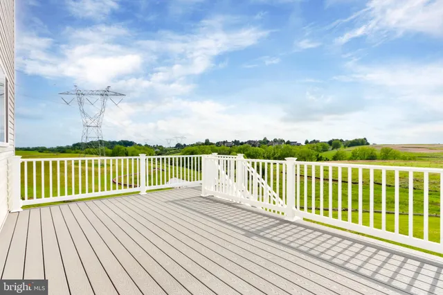 a view of a golf course with chairs