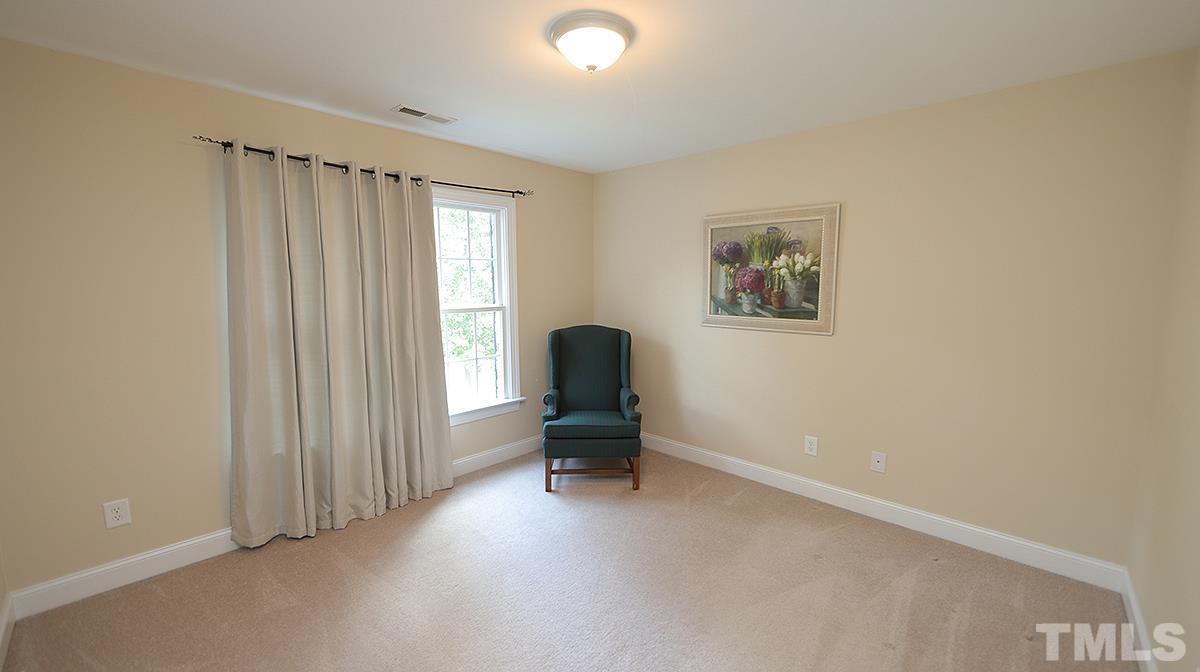 152 Rivers Edge Court Timberlake, NC 27583 - Photo 27 of 41 a living room with furniture and a window
