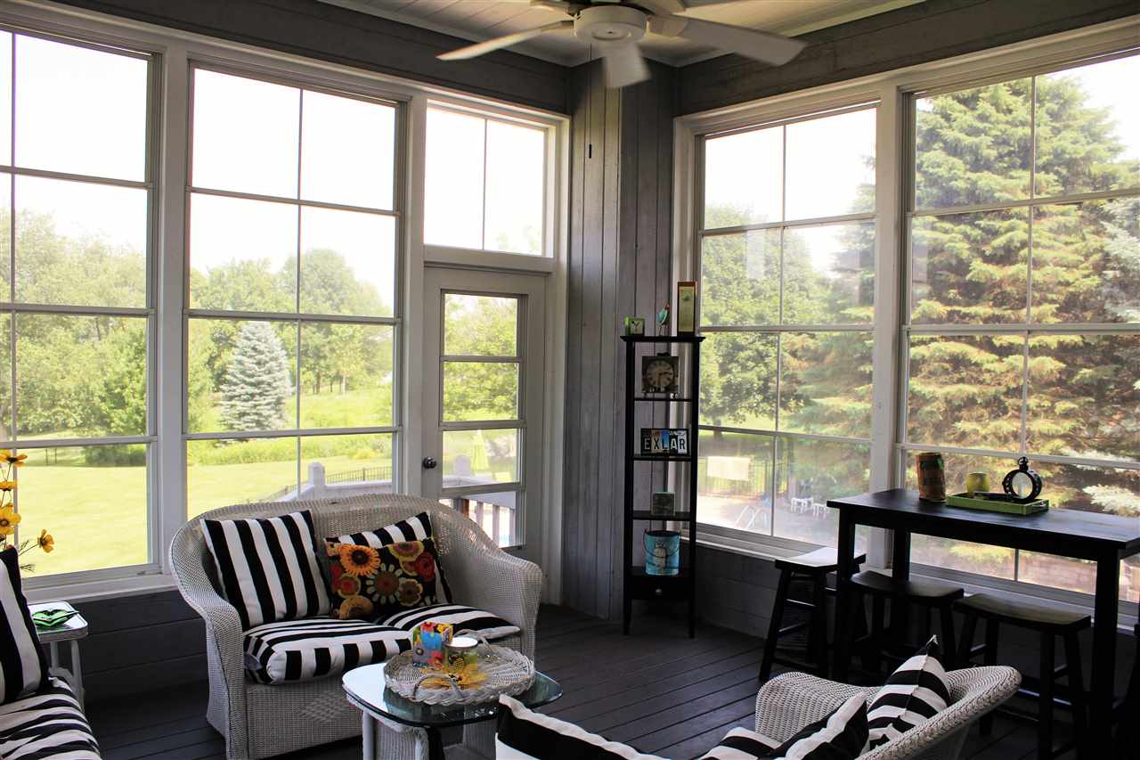 766 Timber Ridge Trail Rockford, IL 61114 - Photo 15 of 25 a living room with furniture and floor to ceiling windows