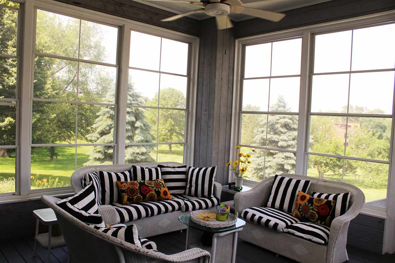 766 Timber Ridge Trail Rockford, IL 61114 - Photo 16 of 25 a living room with furniture and floor to ceiling windows