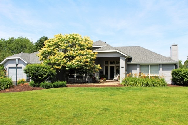 766 Timber Ridge Trail Rockford, IL 61114 - Photo 2 of 25 a front view of a house with garden
