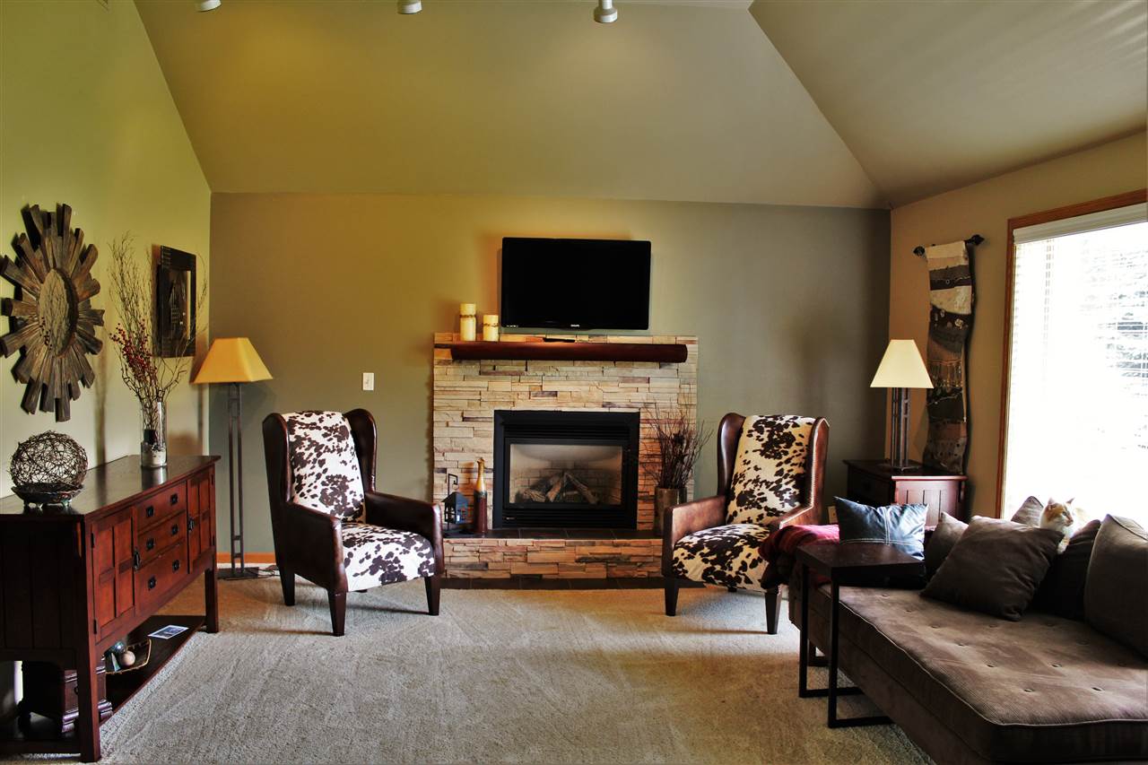 766 Timber Ridge Trail Rockford, IL 61114 - Photo 4 of 25 a living room with furniture and a fireplace