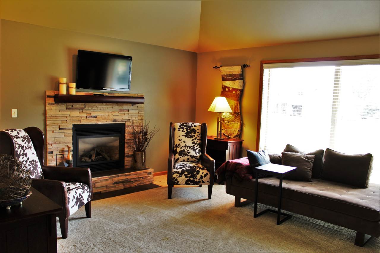 766 Timber Ridge Trail Rockford, IL 61114 - Photo 5 of 25 a living room with furniture and a fireplace